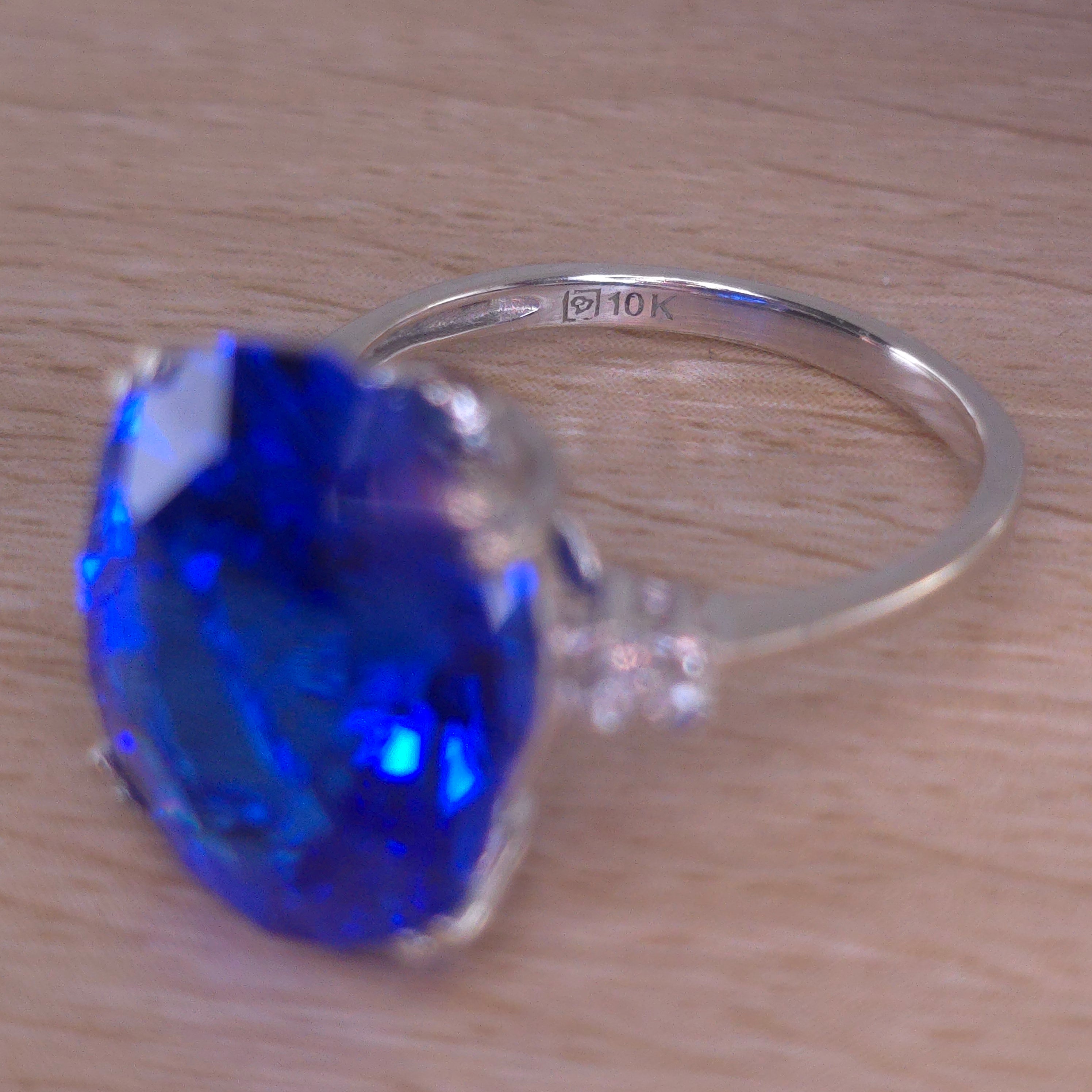 Rare Fire Blue Djeva Lab Spinel Ring with natural Garnet accent stones set in a 10k white gold