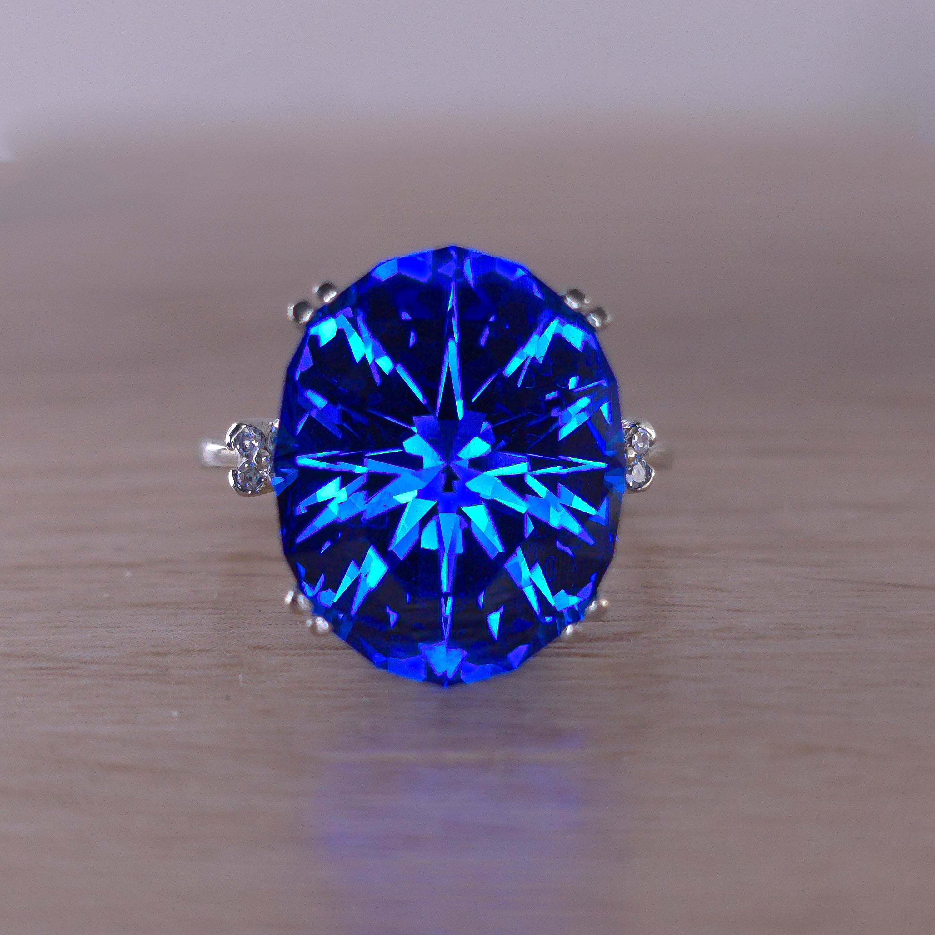 Rare Fire Blue Djeva Lab Spinel Ring with natural Garnet accent stones set in a 10k white gold