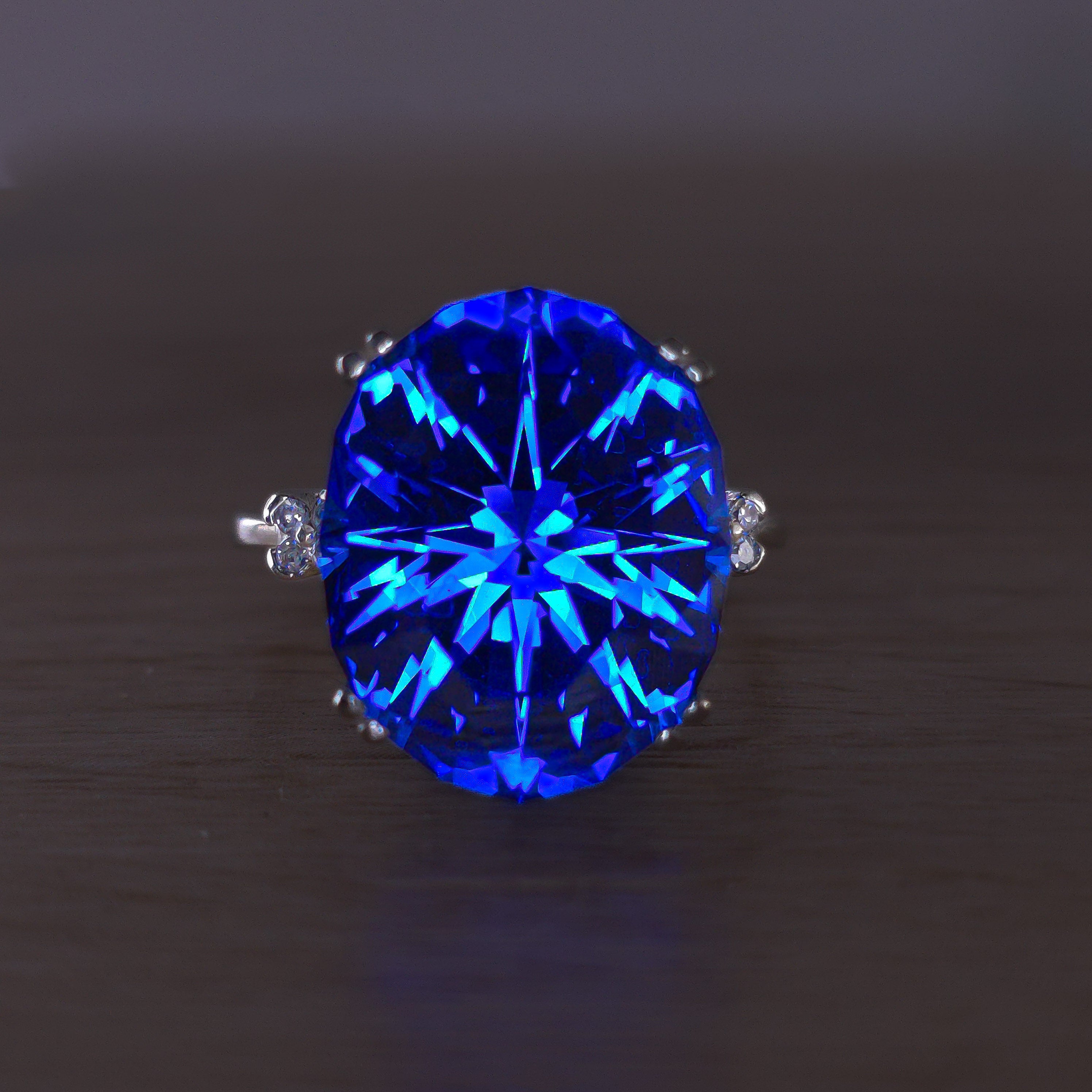 Rare Fire Blue Djeva Lab Spinel Ring with natural Garnet accent stones set in a 10k white gold